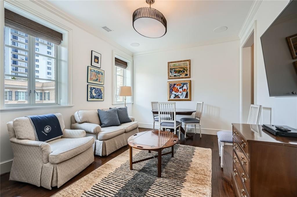 2440 Peachtree Road Northwest, Unit 9 Atlanta, GA 30305 - Photo 35 of 48 a living room with furniture a flat screen tv and a window