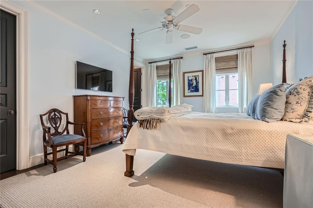 2440 Peachtree Road Northwest, Unit 9 Atlanta, GA 30305 - Photo 36 of 48 a bed room with a bed and a chair