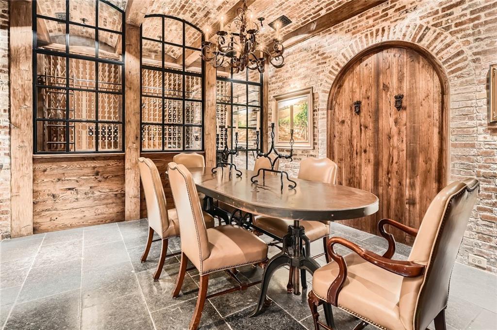 2440 Peachtree Road Northwest, Unit 9 Atlanta, GA 30305 - Photo 39 of 48 a dining room with furniture and wooden floor