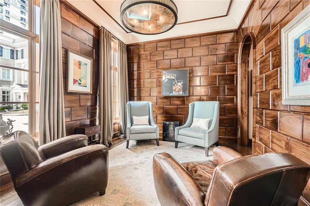 2440 Peachtree Road Northwest, Unit 9 Atlanta, GA 30305 - Photo 4 of 48 a living room with furniture and a large window