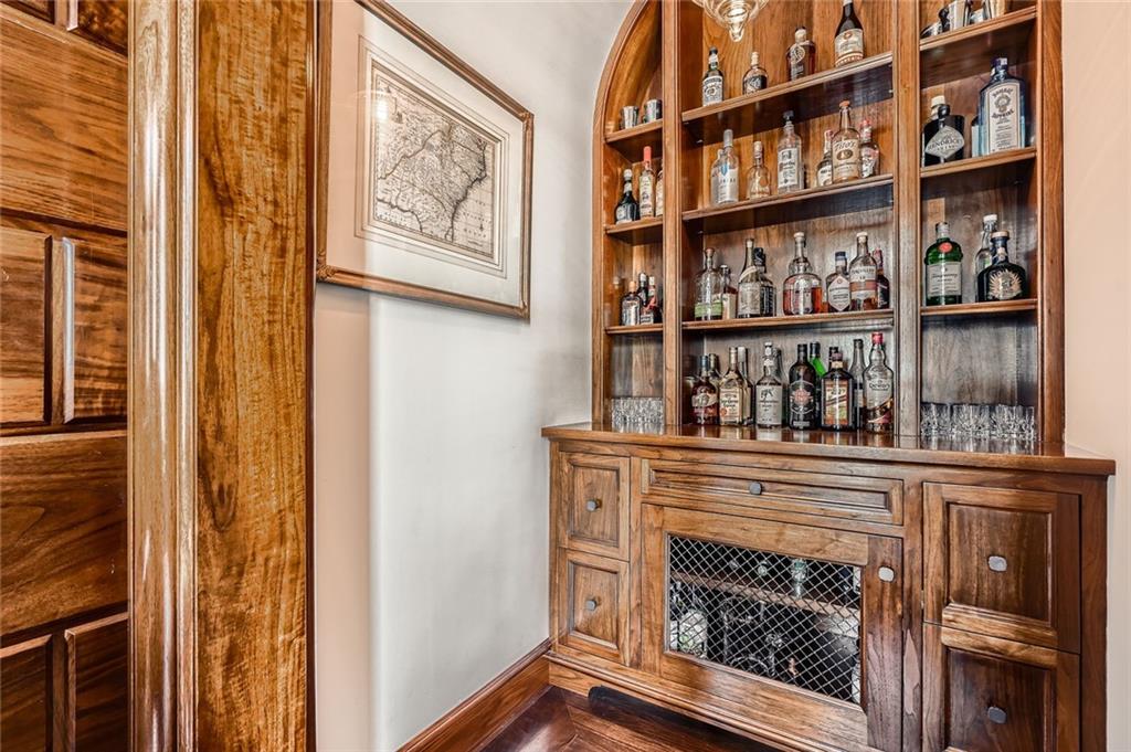 2440 Peachtree Road Northwest, Unit 9 Atlanta, GA 30305 - Photo 5 of 48 a living room with a wooden floor and a fireplace