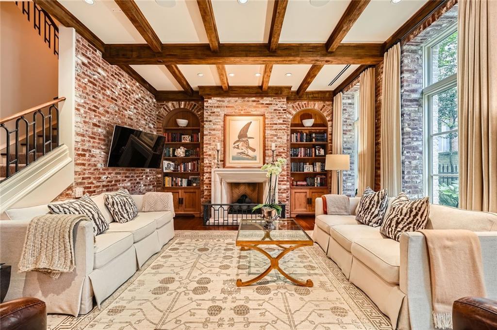 2440 Peachtree Road Northwest, Unit 9 Atlanta, GA 30305 - Photo 7 of 48 a living room with furniture a fireplace and a flat screen tv