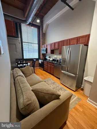 a living room with furniture window and a couch