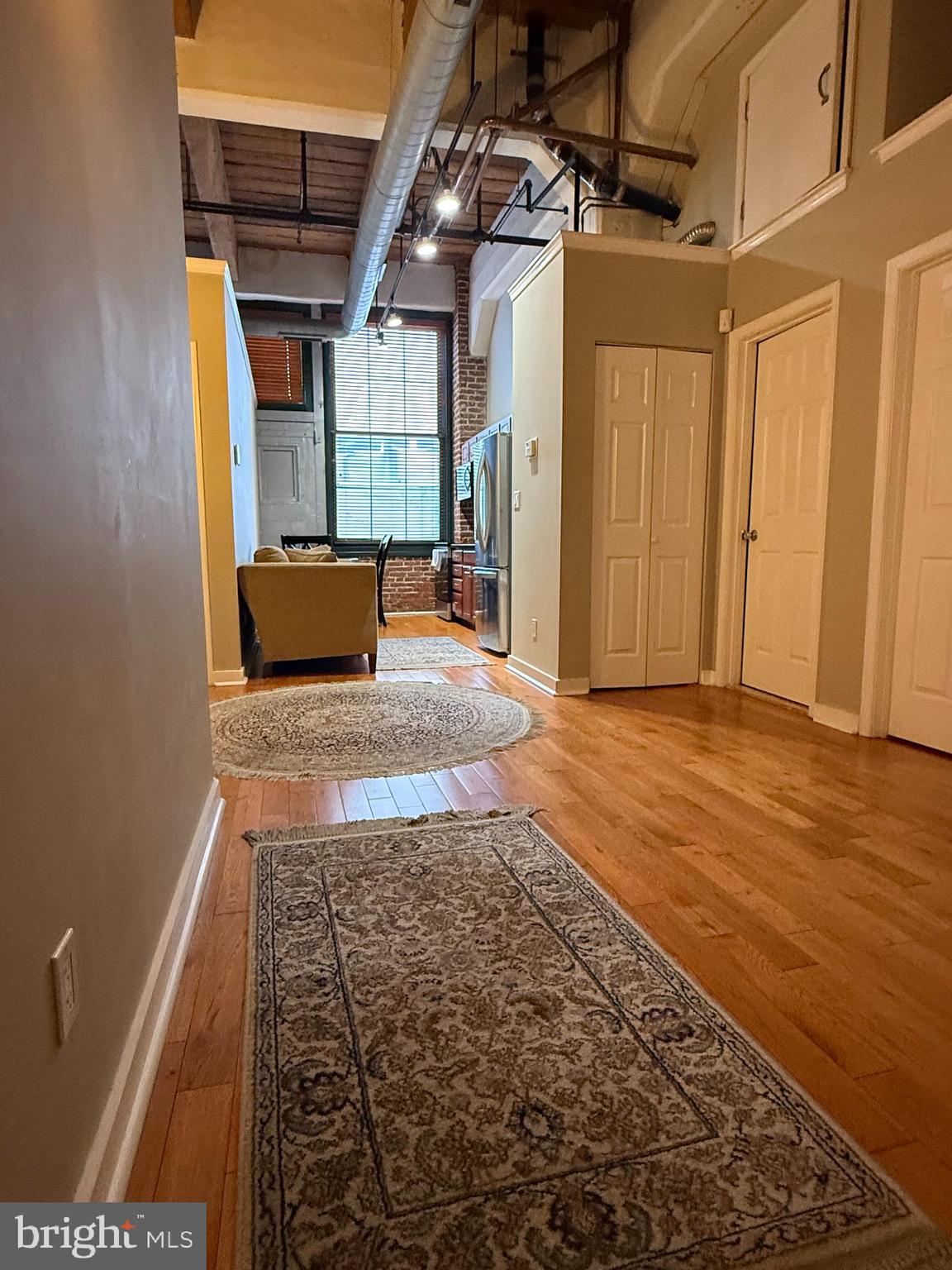 1010 Arch Street, Unit 304 Philadelphia, PA 19107 - Photo 6 of 10 a living room with a rug