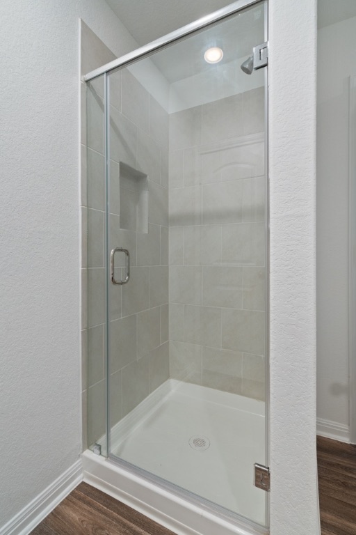 14013 John Aregood Pass Elgin, TX 78621 - Photo 16 of 31 a bathroom with a shower and a bath tub