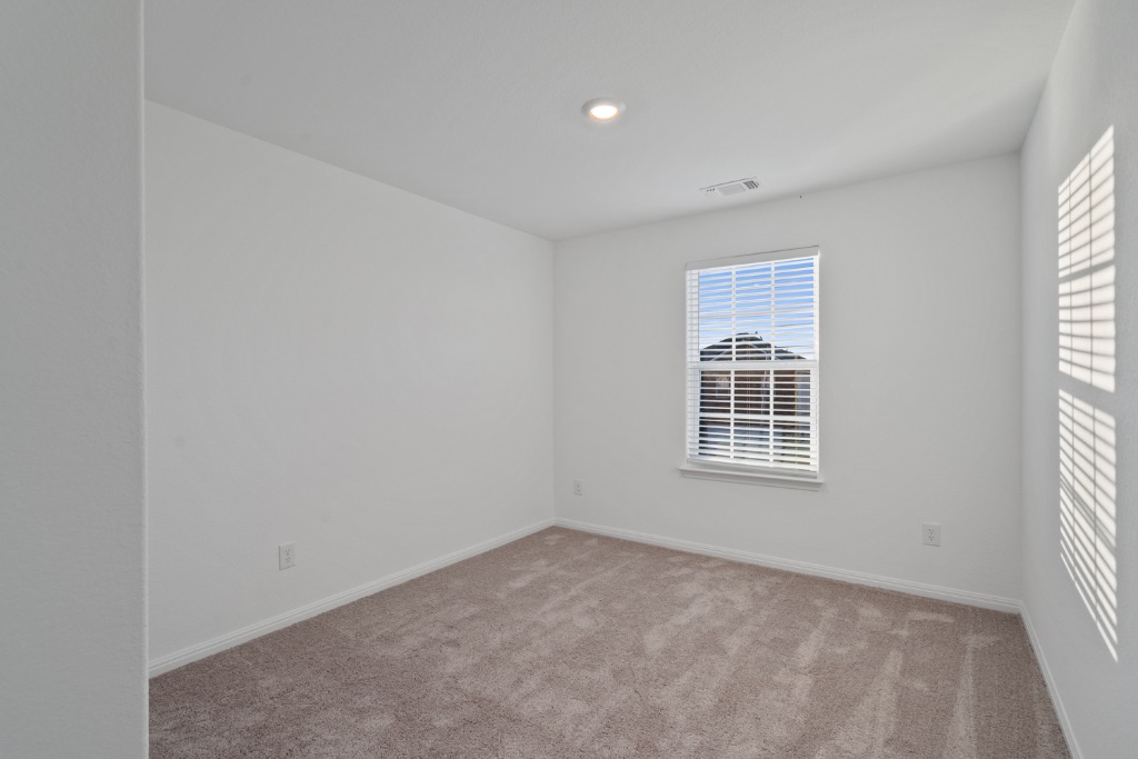 14013 John Aregood Pass Elgin, TX 78621 - Photo 21 of 31 an empty room with a window