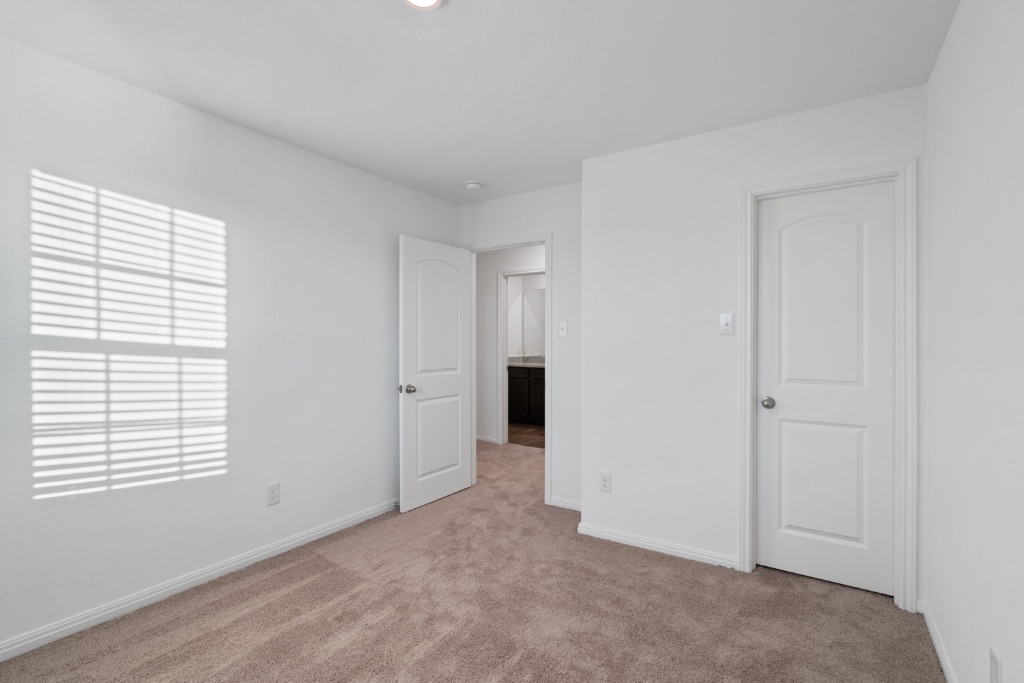 14013 John Aregood Pass Elgin, TX 78621 - Photo 22 of 31 a view of an empty room with a window