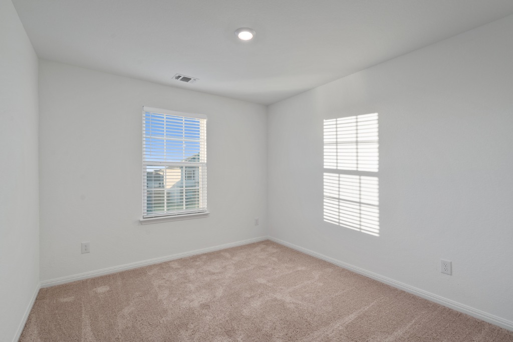 14013 John Aregood Pass Elgin, TX 78621 - Photo 25 of 31 an empty room with a window