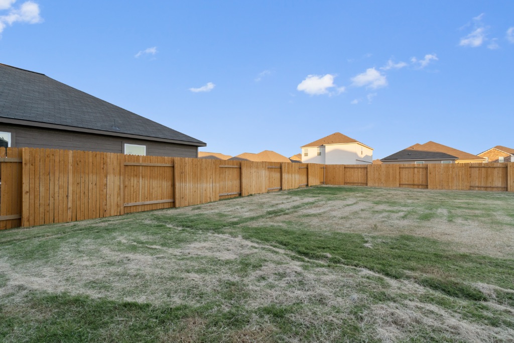 14013 John Aregood Pass Elgin, TX 78621 - Photo 28 of 31 a view of a backyard