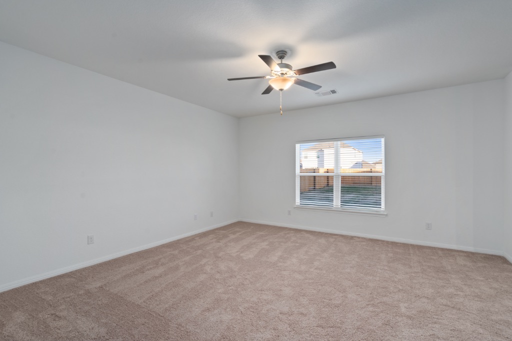 14013 John Aregood Pass Elgin, TX 78621 - Photo 5 of 31 a view of an empty room with a window