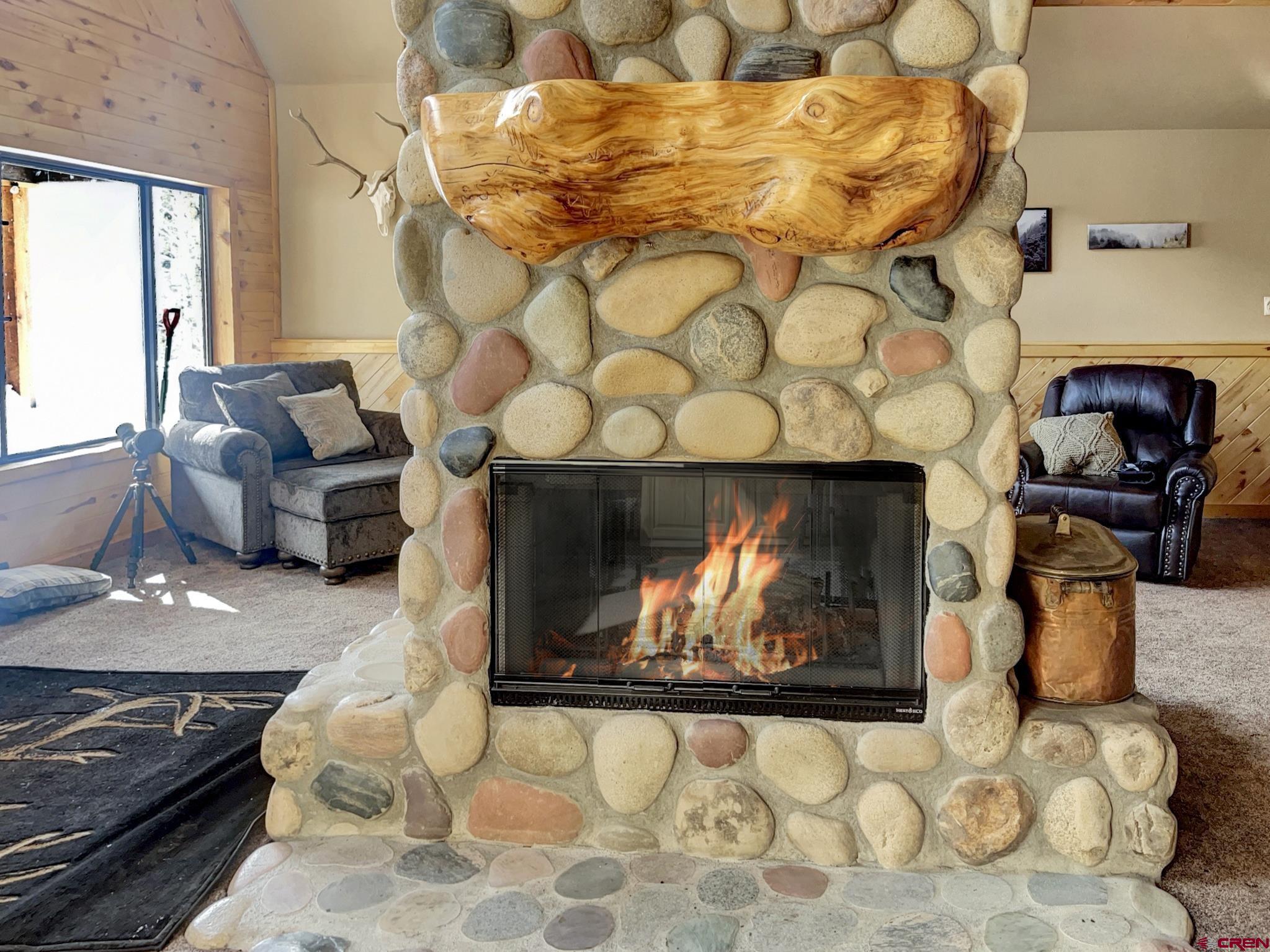 Lot 1 Aspen Hills Road Cedaredge, CO 81413 - Photo 14 of 32 a living room with furniture and a fireplace