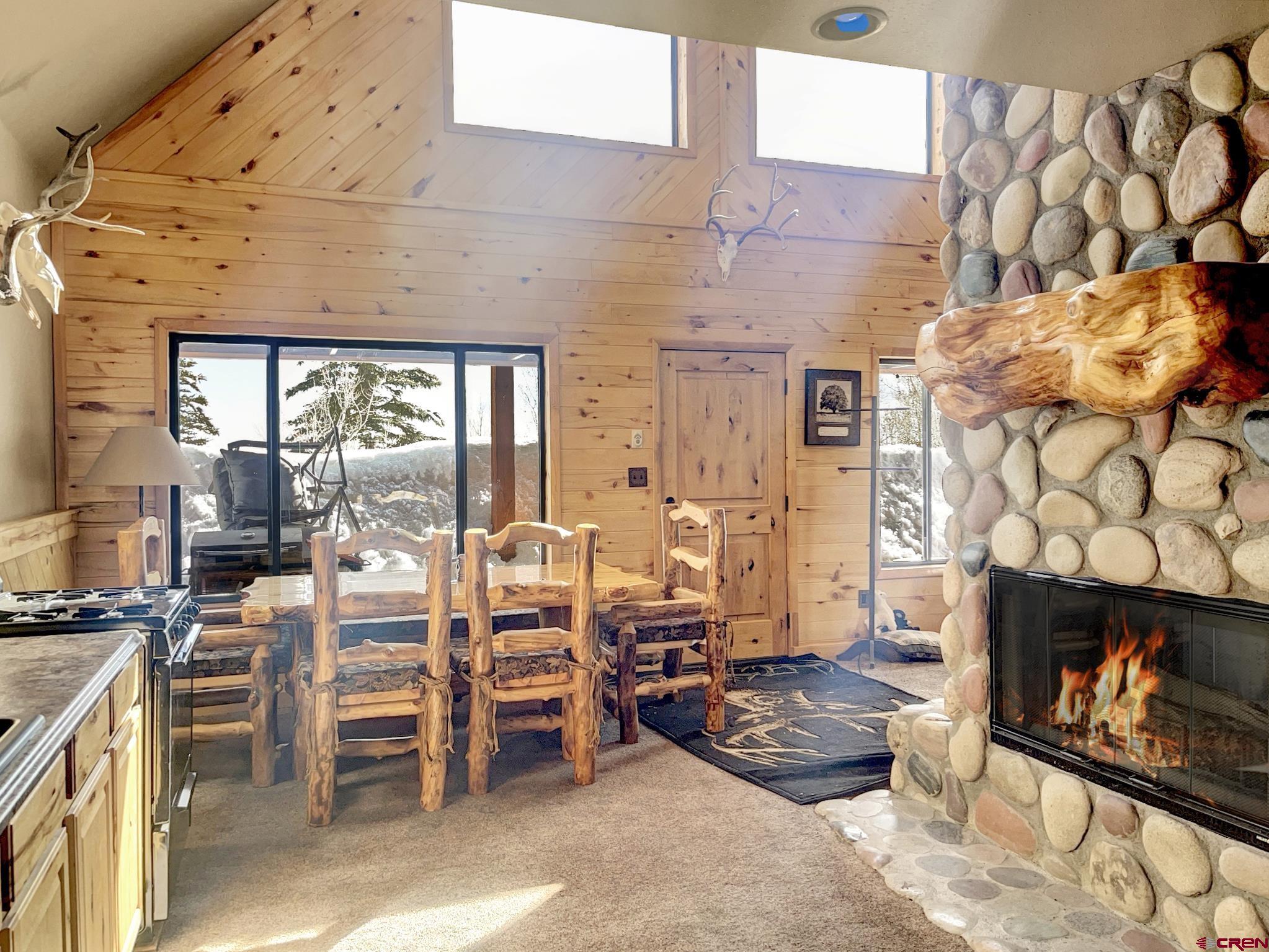 Lot 1 Aspen Hills Road Cedaredge, CO 81413 - Photo 15 of 32 a living room with furniture and a fireplace