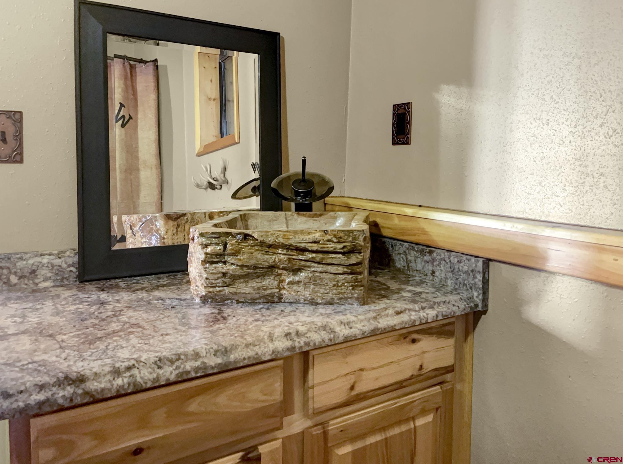 Lot 1 Aspen Hills Road Cedaredge, CO 81413 - Photo 19 of 32 a bathroom with sink and mirror
