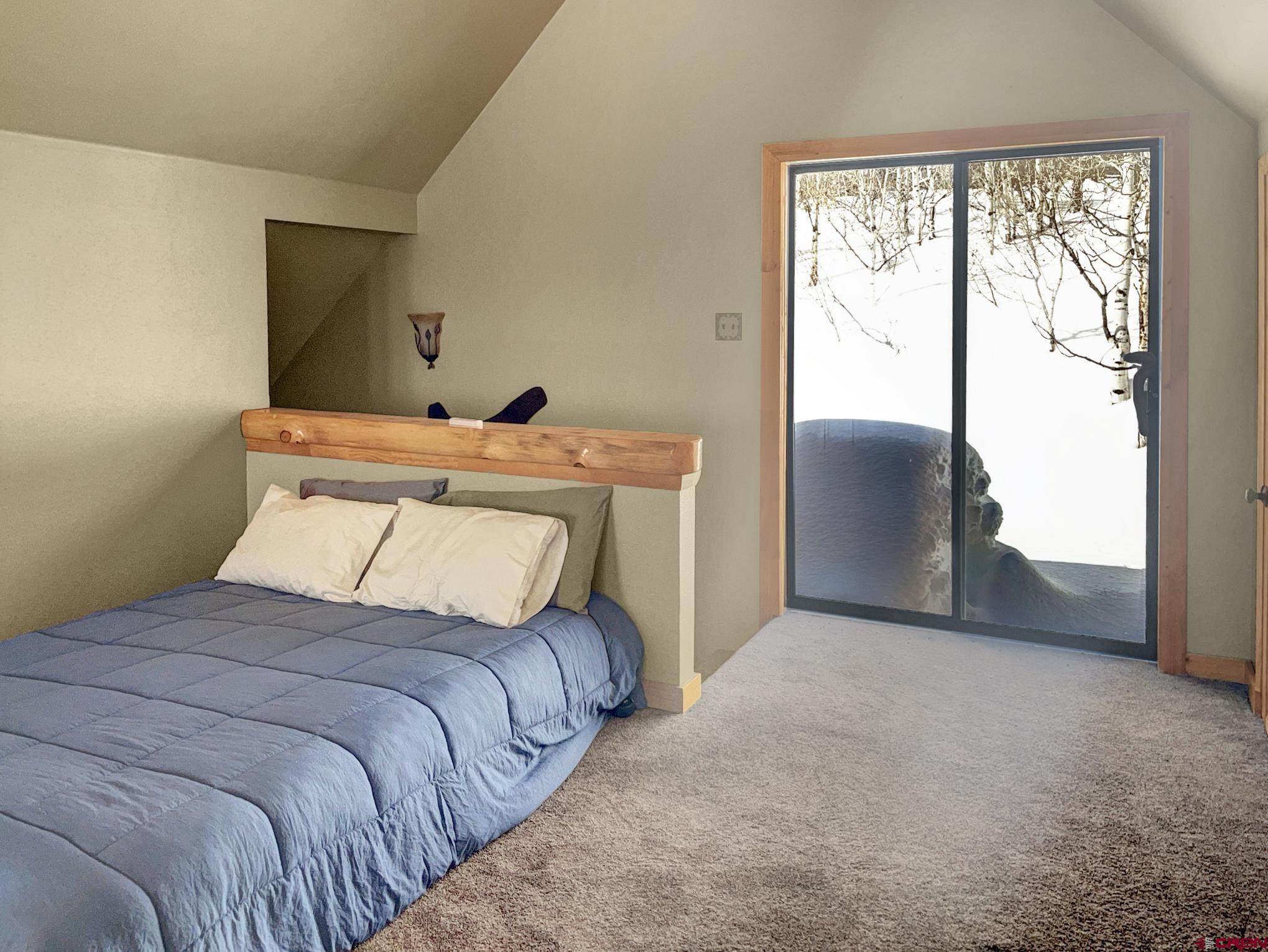 Lot 1 Aspen Hills Road Cedaredge, CO 81413 - Photo 23 of 32 a bedroom with a bed and a window