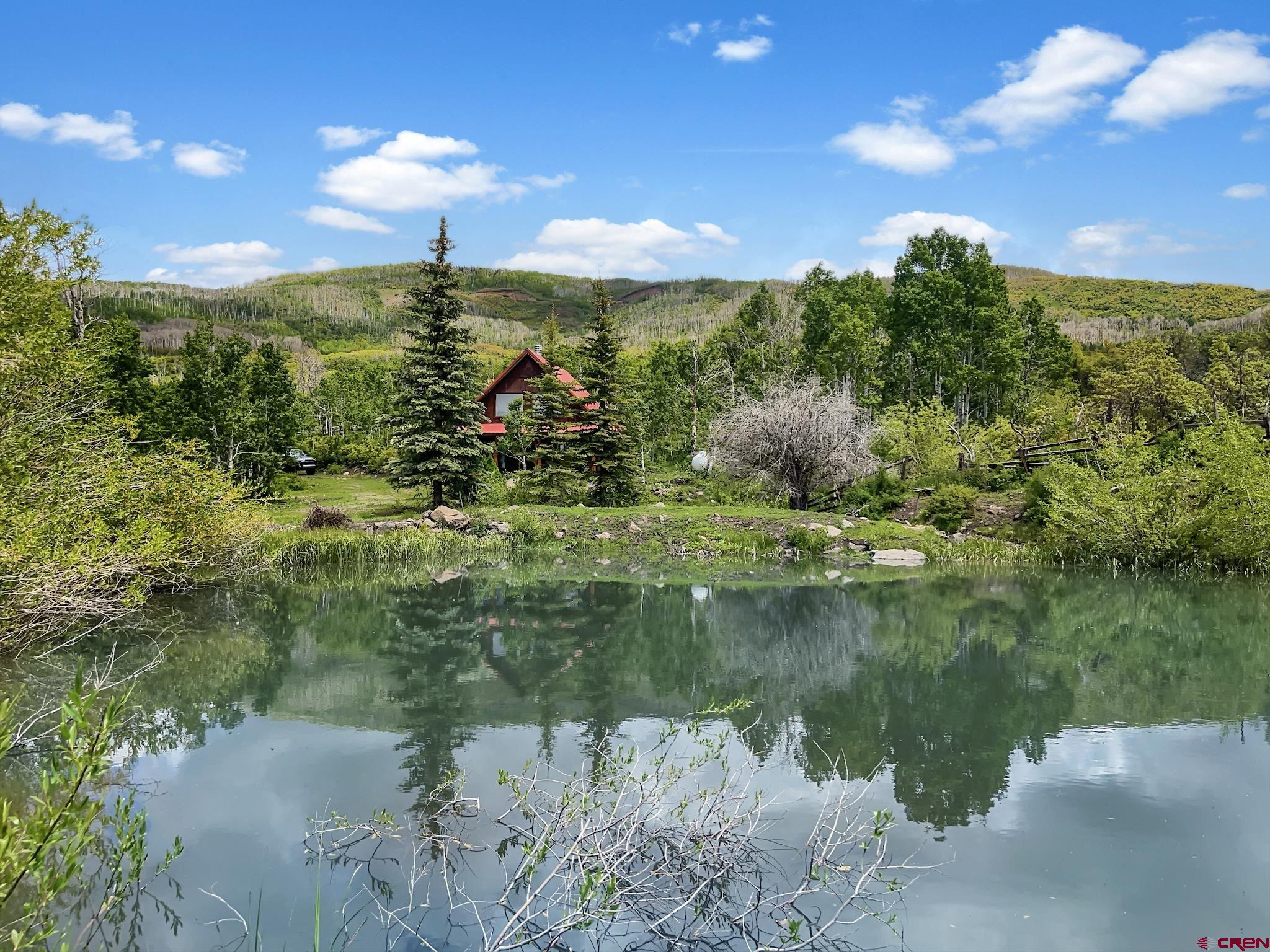 Lot 1 Aspen Hills Road Cedaredge, CO 81413 - Photo 3 of 32 a view of a lake from a yard
