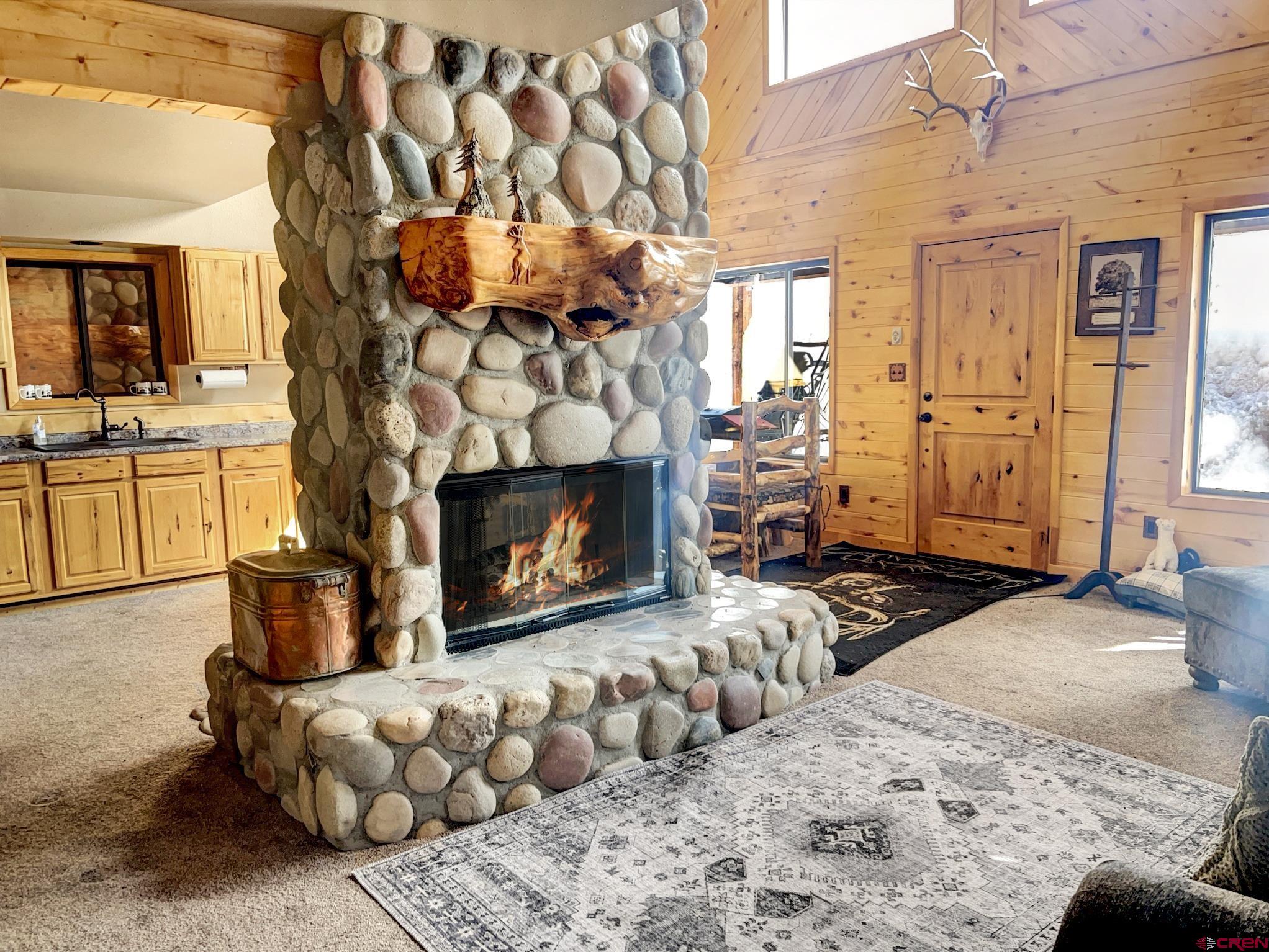 Lot 1 Aspen Hills Road Cedaredge, CO 81413 - Photo 10 of 32 a bedroom with furniture and a fireplace
