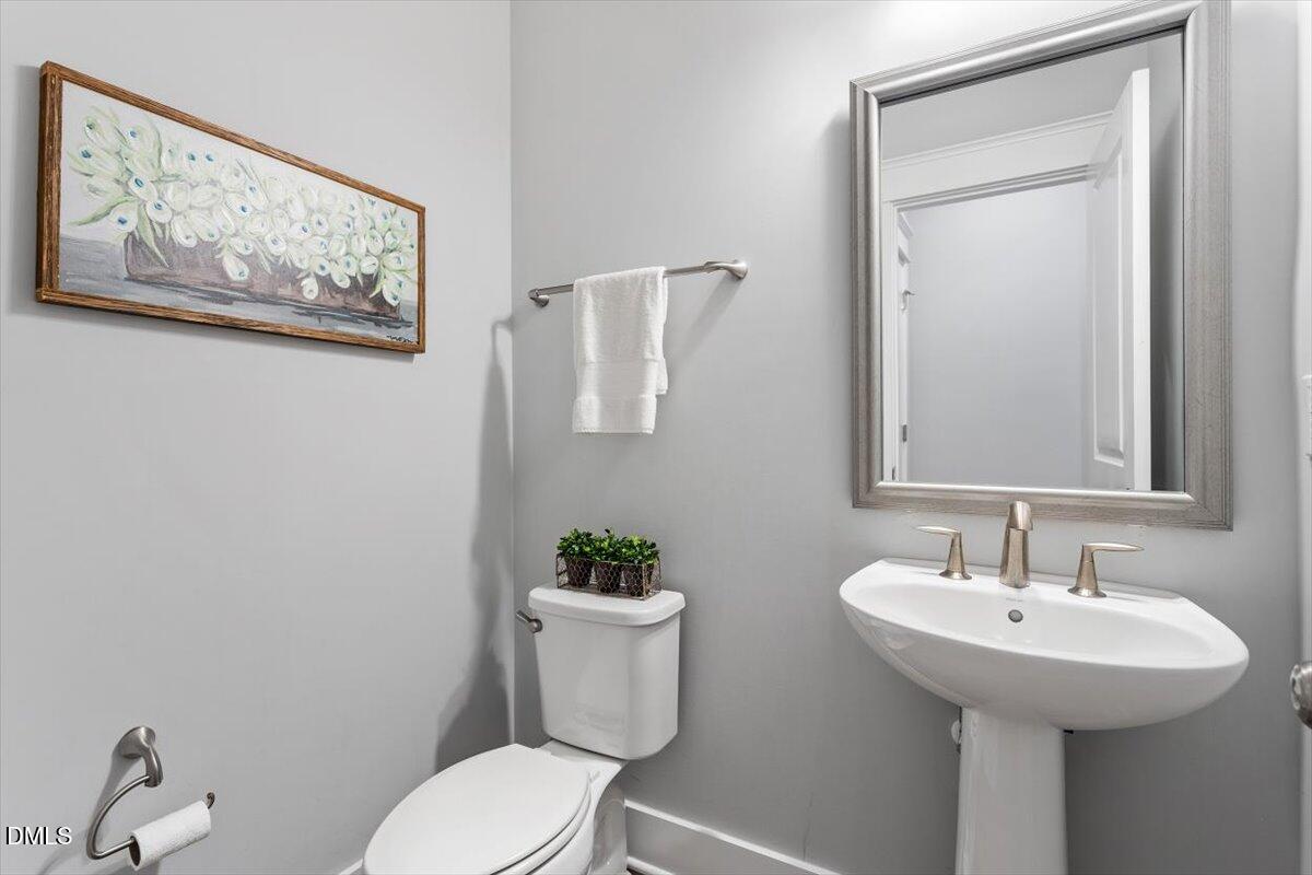 2412 Spindle Court Raleigh, NC 27603 - Photo 21 of 42 half bath-main floor