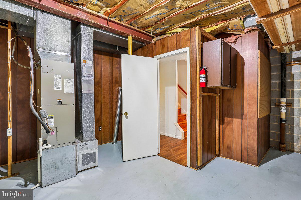 76 Timber Rock Road Gaithersburg, MD 20878 - Photo 42 of 51 a view of a hallway with wooden walls