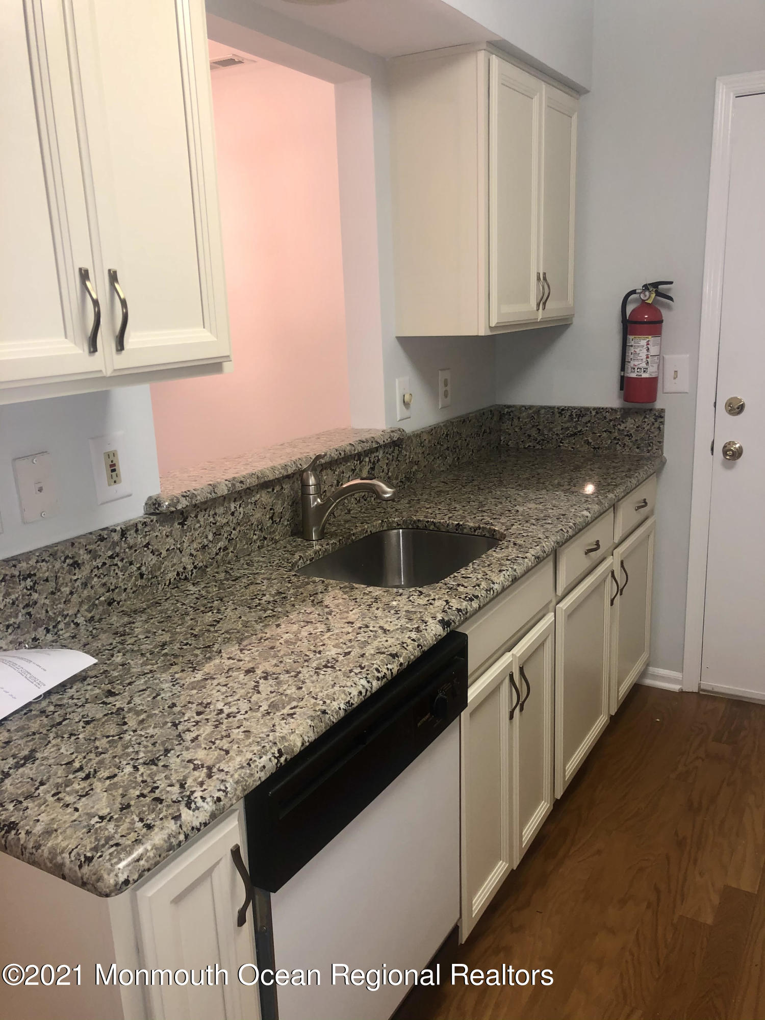 5 Racquet Road Wall, NJ 07719 - Photo 11 of 21 a kitchen with stainless steel appliances granite countertop a sink stove and cabinets