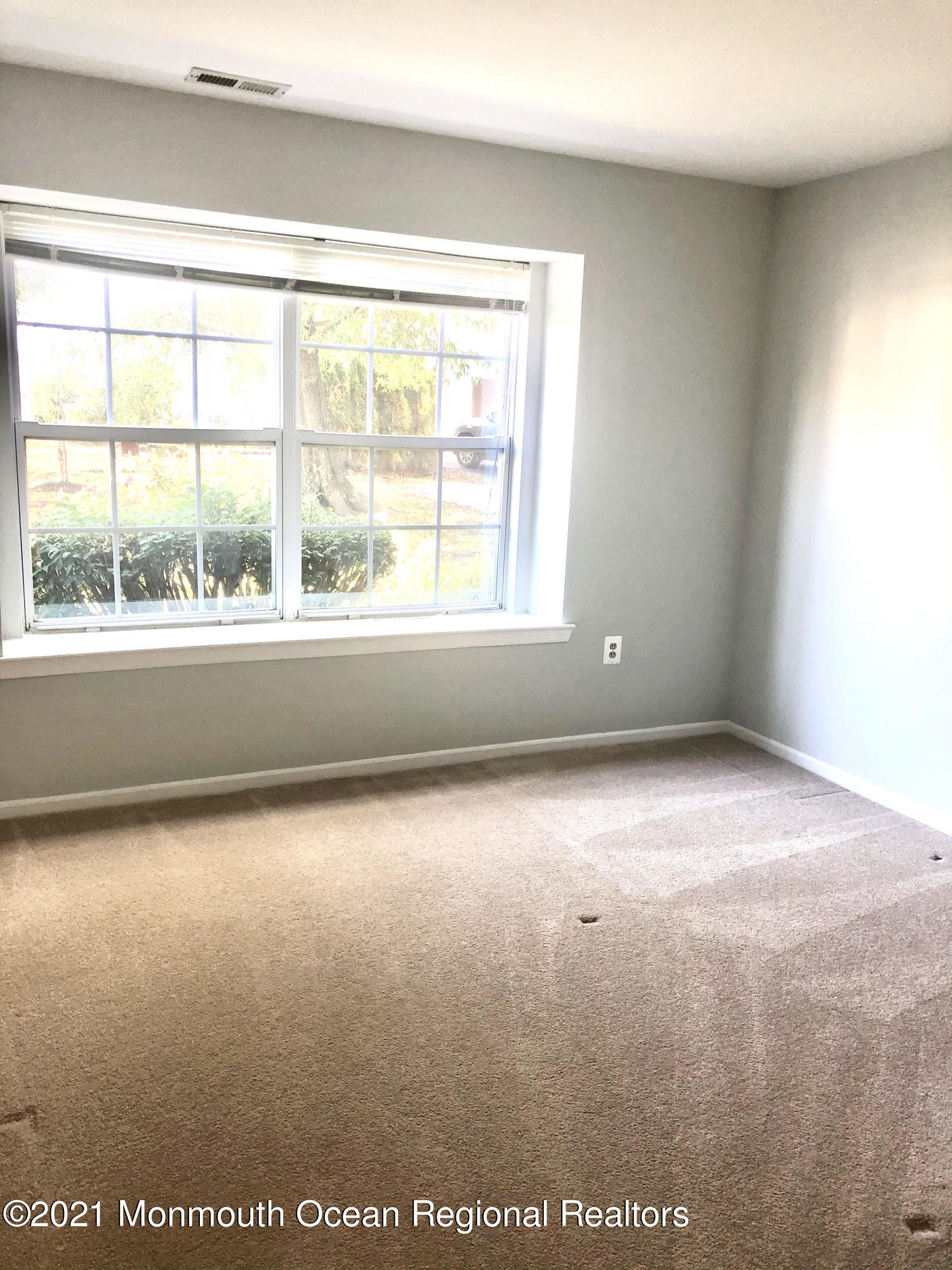 5 Racquet Road Wall, NJ 07719 - Photo 14 of 21 an empty room with a window