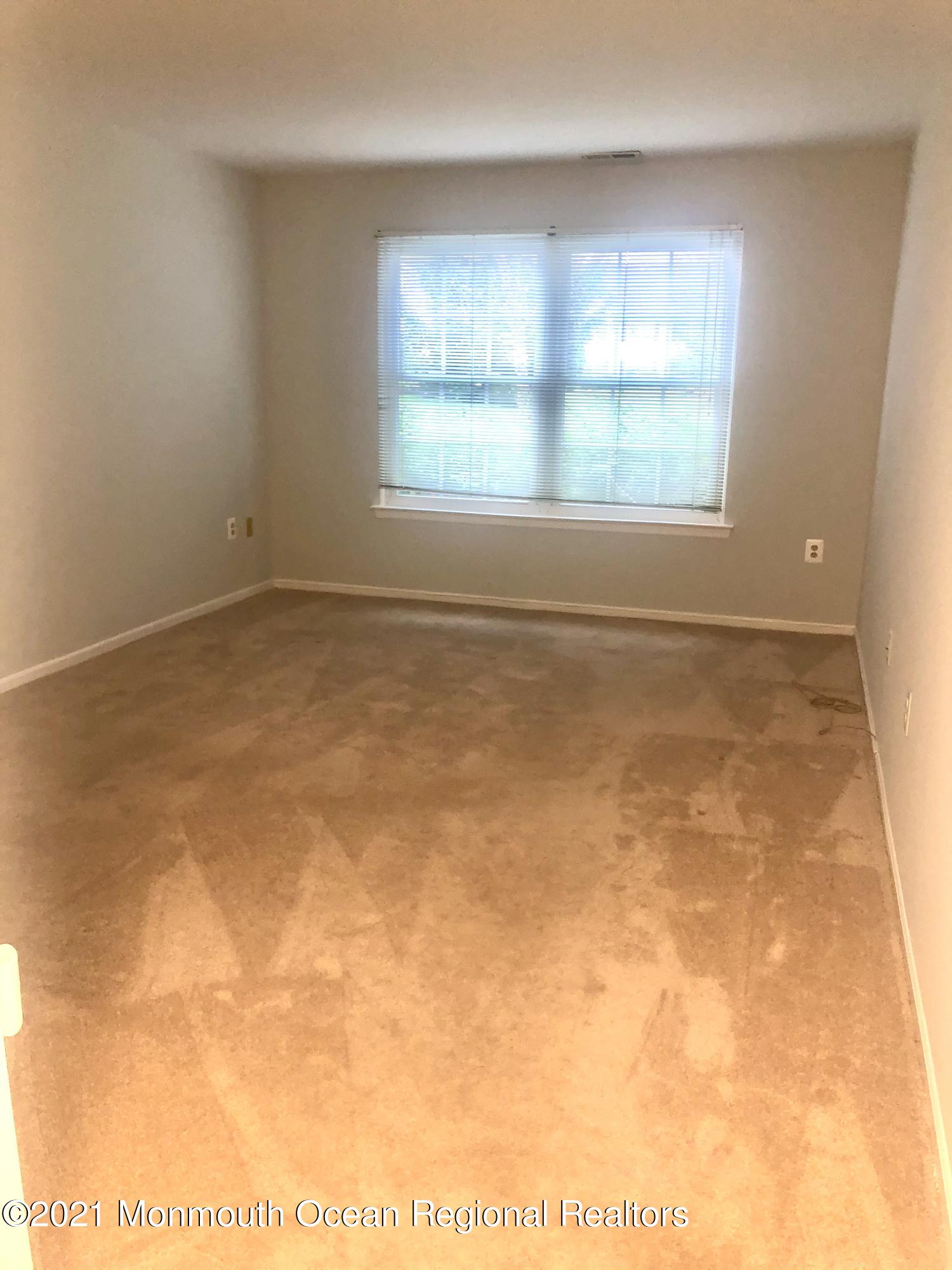 5 Racquet Road Wall, NJ 07719 - Photo 16 of 21 a view of an empty room with a window