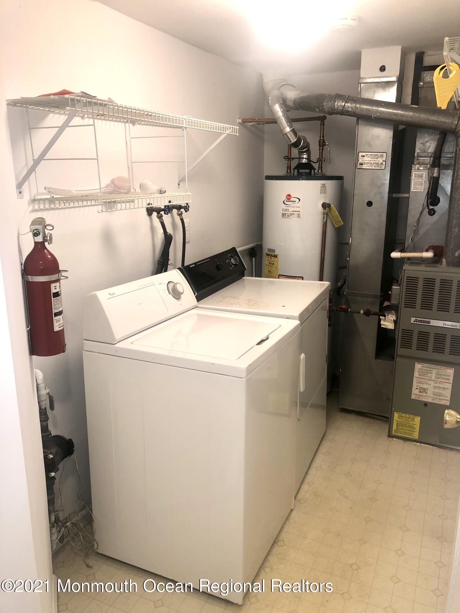 5 Racquet Road Wall, NJ 07719 - Photo 21 of 21 a utility room with dryer and washer