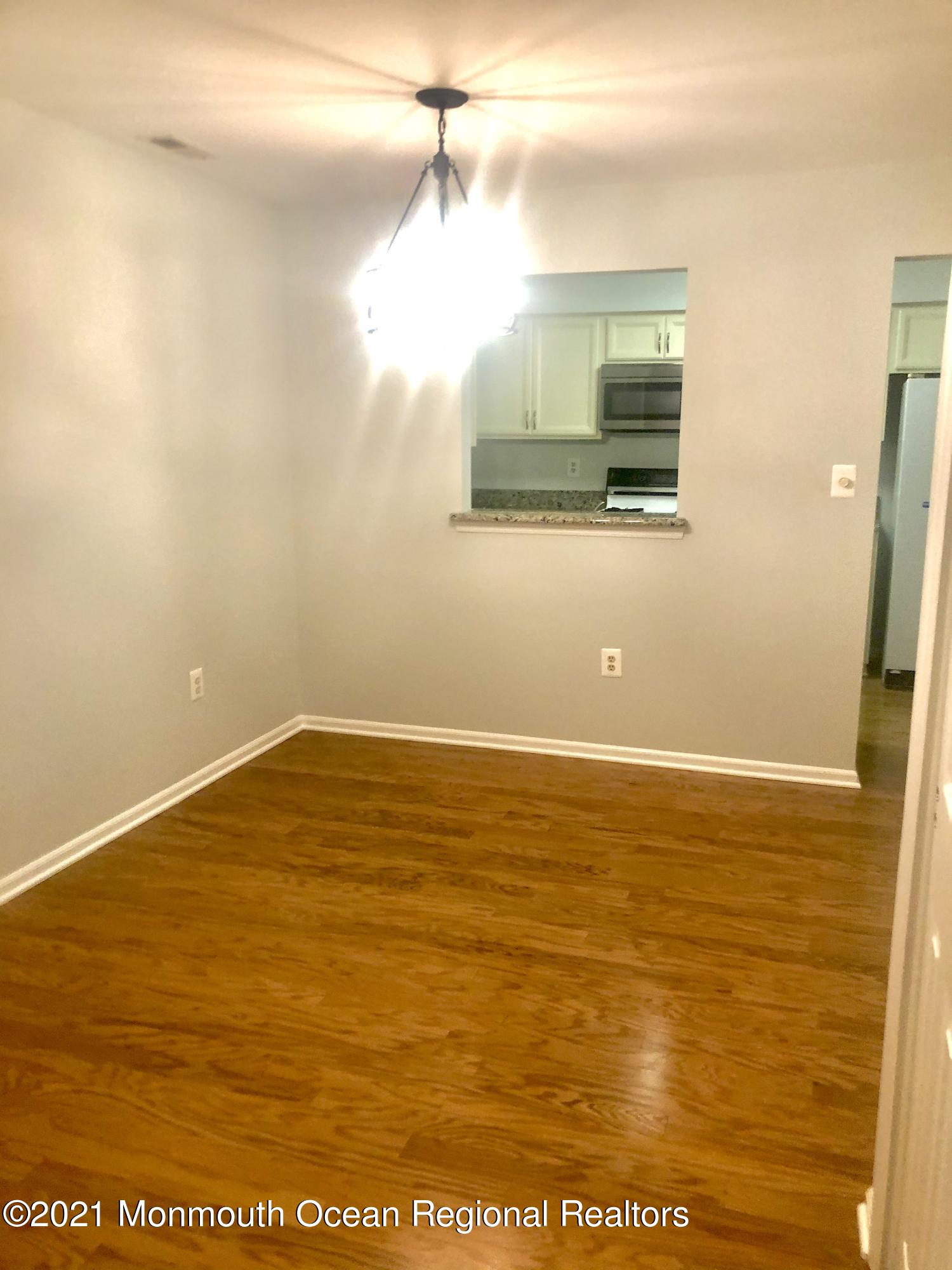 5 Racquet Road Wall, NJ 07719 - Photo 8 of 21 a view of a room with wooden floor and window
