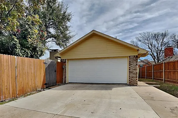 a front view of a house with garage