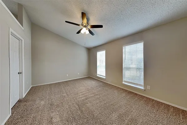 a view of empty room with windows