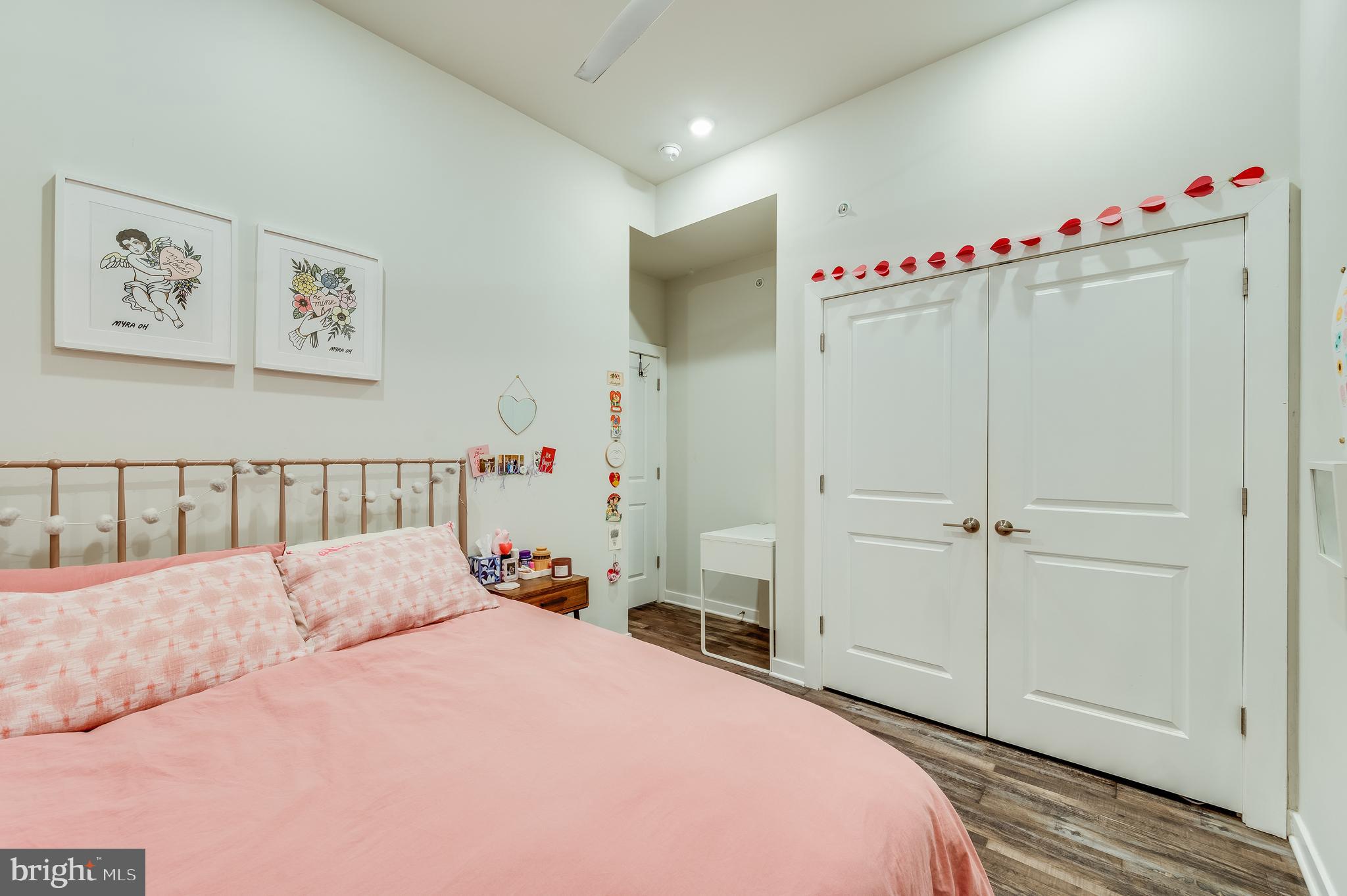 3708 Haverford Avenue, Unit 1 Philadelphia, PA 19104 - Photo 12 of 20 a bedroom with a large bed and a chandelier