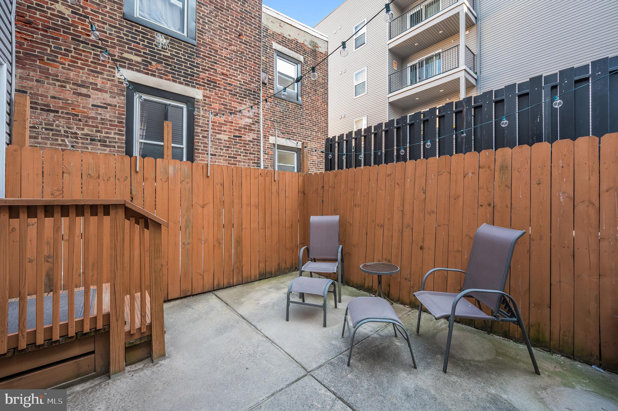 3708 Haverford Avenue, Unit 1 Philadelphia, PA 19104 - Photo 15 of 20 a backyard of a house with table and chairs