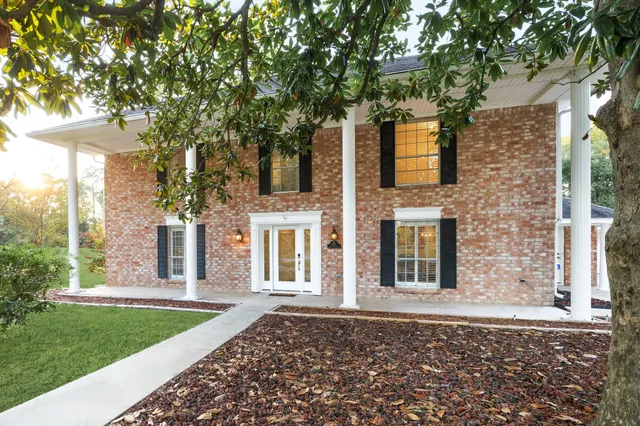front view of a house with a garden
