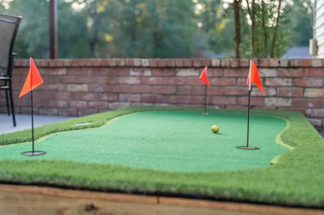a view of a house with backyard porch and sitting area