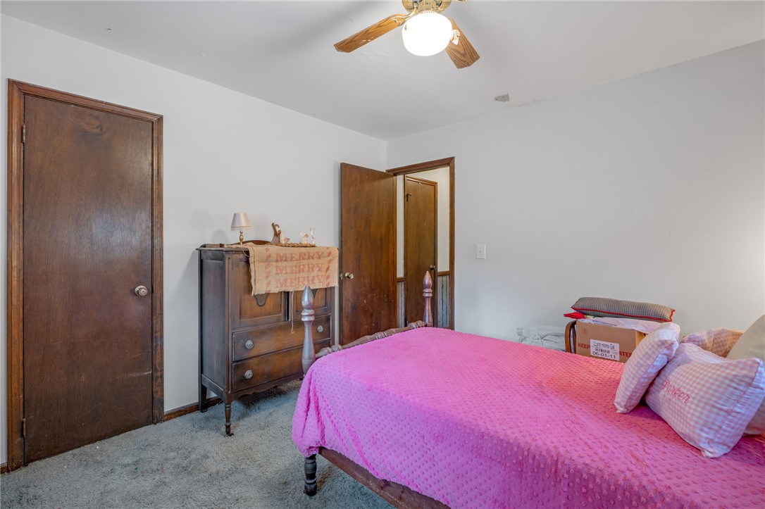 131 Bowen Road Anderson, SC 29621 - Photo 23 of 36 Rich wood interior doors complement the carpeted flooring in this classic bedroom.