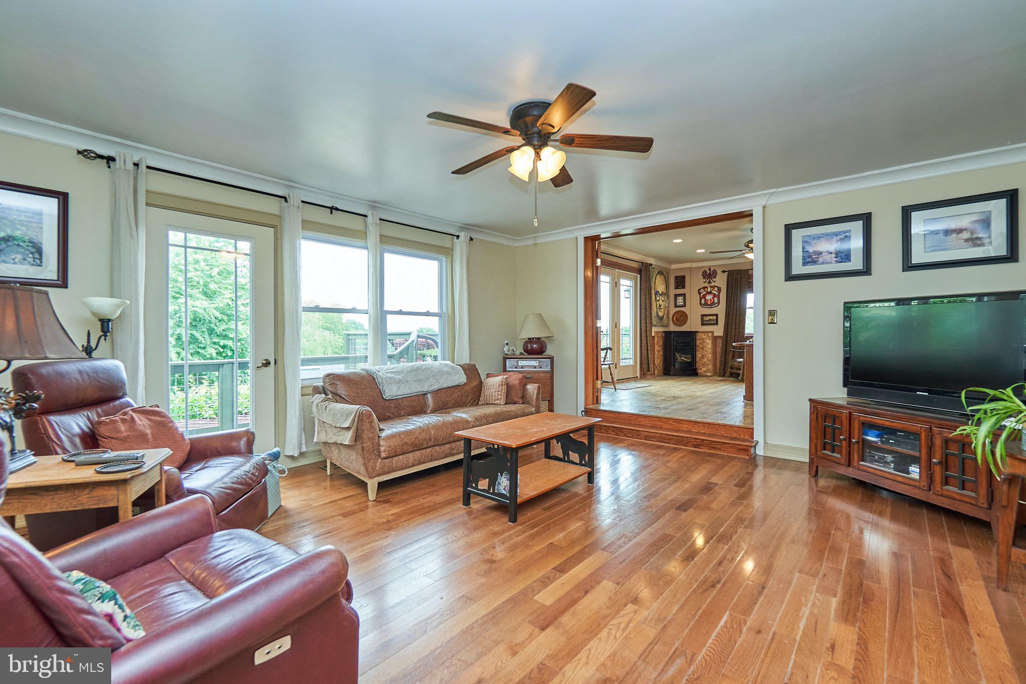 36716 North Fork Road Purcellville, VA 20132 - Photo 21 of 78 Family Room off Kitchen with Door to Deck