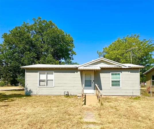a house with trees in the background