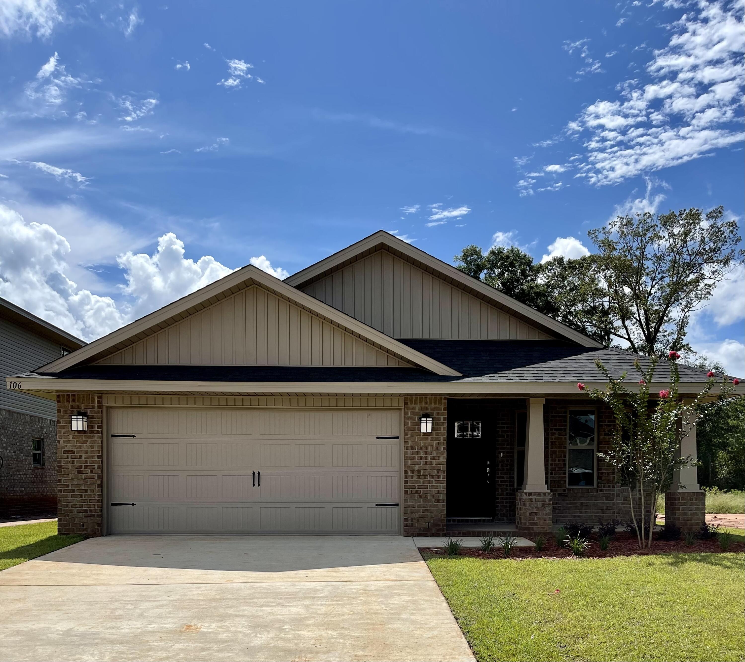 106 Ridgeway Circle Crestview, FL 32536 - Photo 1 of 25 a front view of a house with a yard