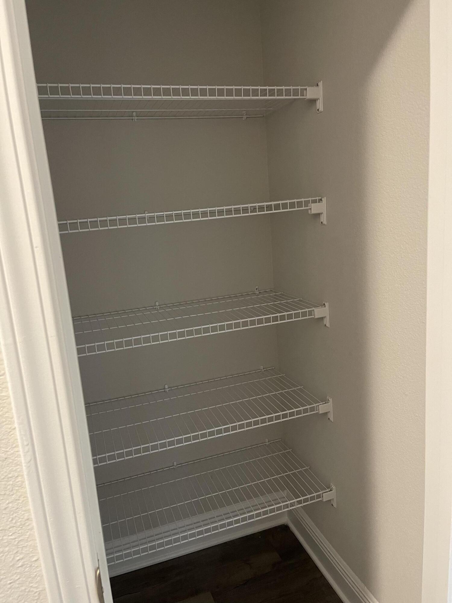 106 Ridgeway Circle Crestview, FL 32536 - Photo 19 of 25 a view of walk in closet with empty racks