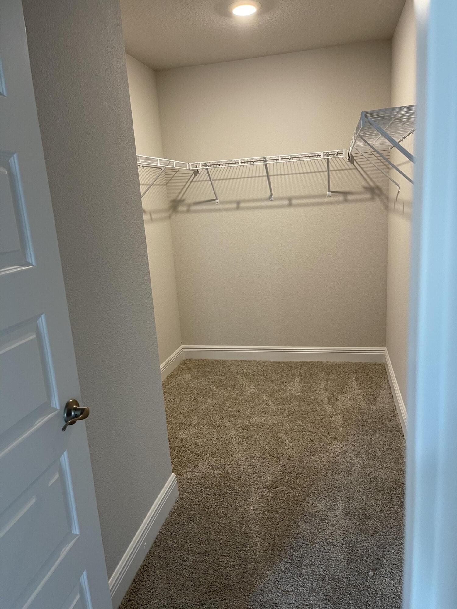 106 Ridgeway Circle Crestview, FL 32536 - Photo 20 of 25 a view of a room with racks on the wall