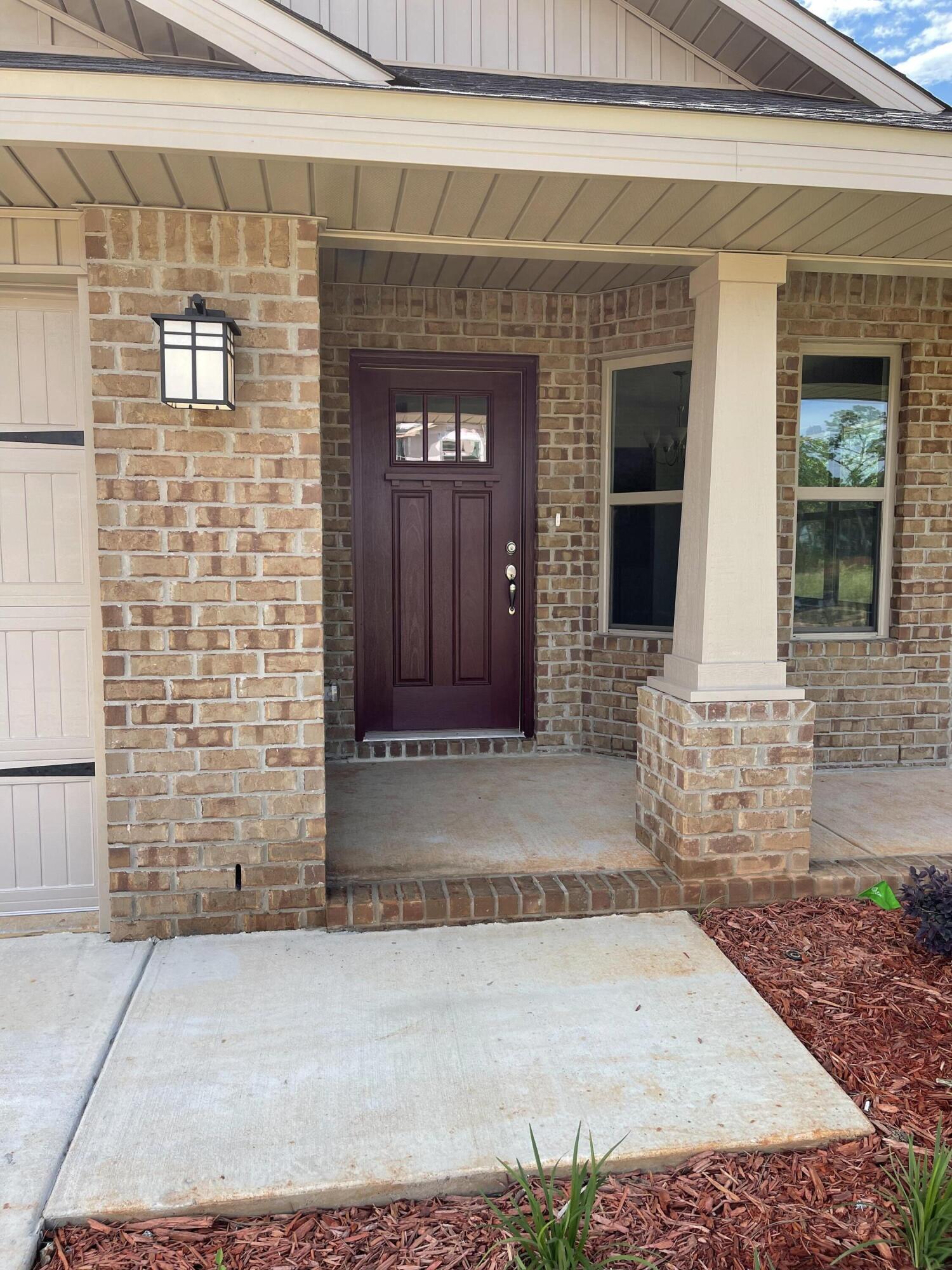 106 Ridgeway Circle Crestview, FL 32536 - Photo 2 of 25 a front view of a house with a yard