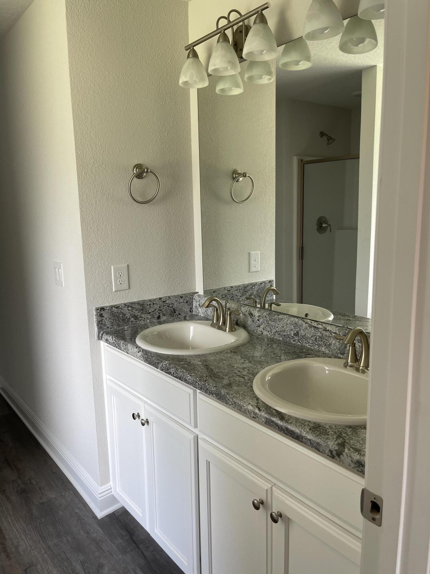 106 Ridgeway Circle Crestview, FL 32536 - Photo 21 of 25 a bathroom with a granite countertop sink and a mirror