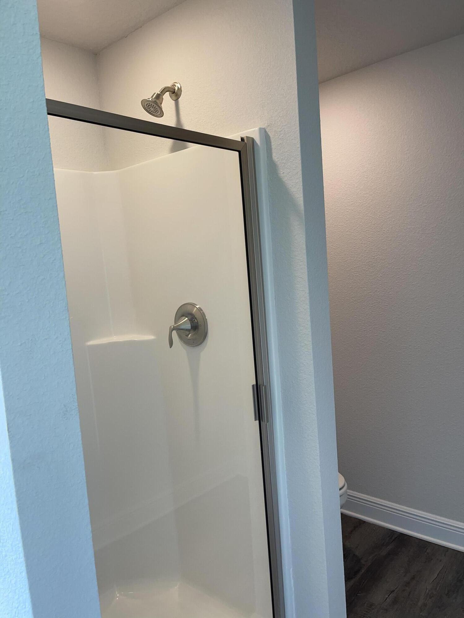 106 Ridgeway Circle Crestview, FL 32536 - Photo 22 of 25 a bathroom with a glass shower door