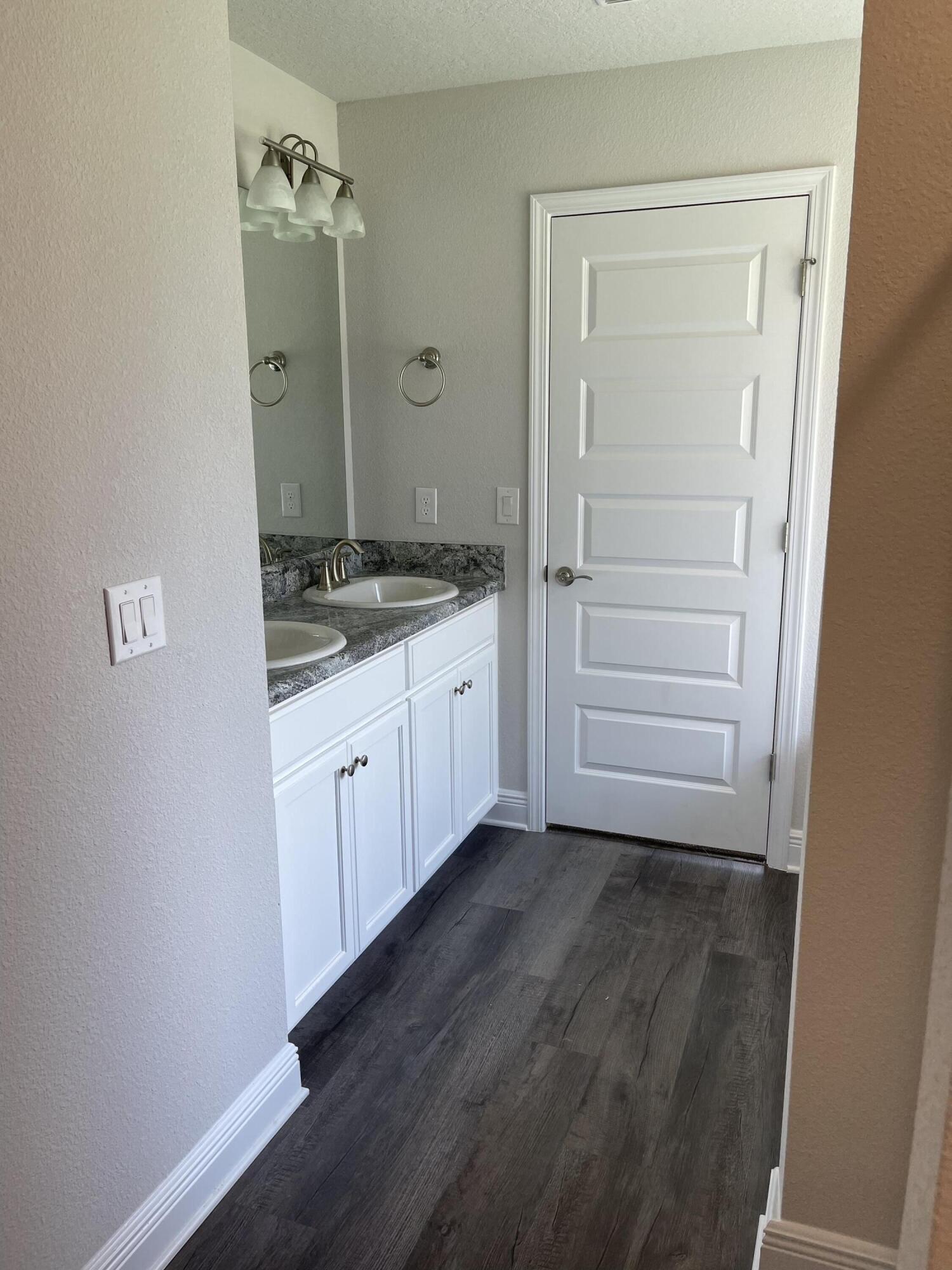 106 Ridgeway Circle Crestview, FL 32536 - Photo 23 of 25 a view of a bathroom with sink and mirror