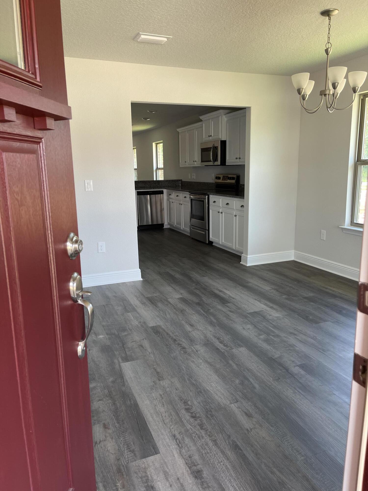 106 Ridgeway Circle Crestview, FL 32536 - Photo 4 of 25 a view of a kitchen cabinets and wooden floor