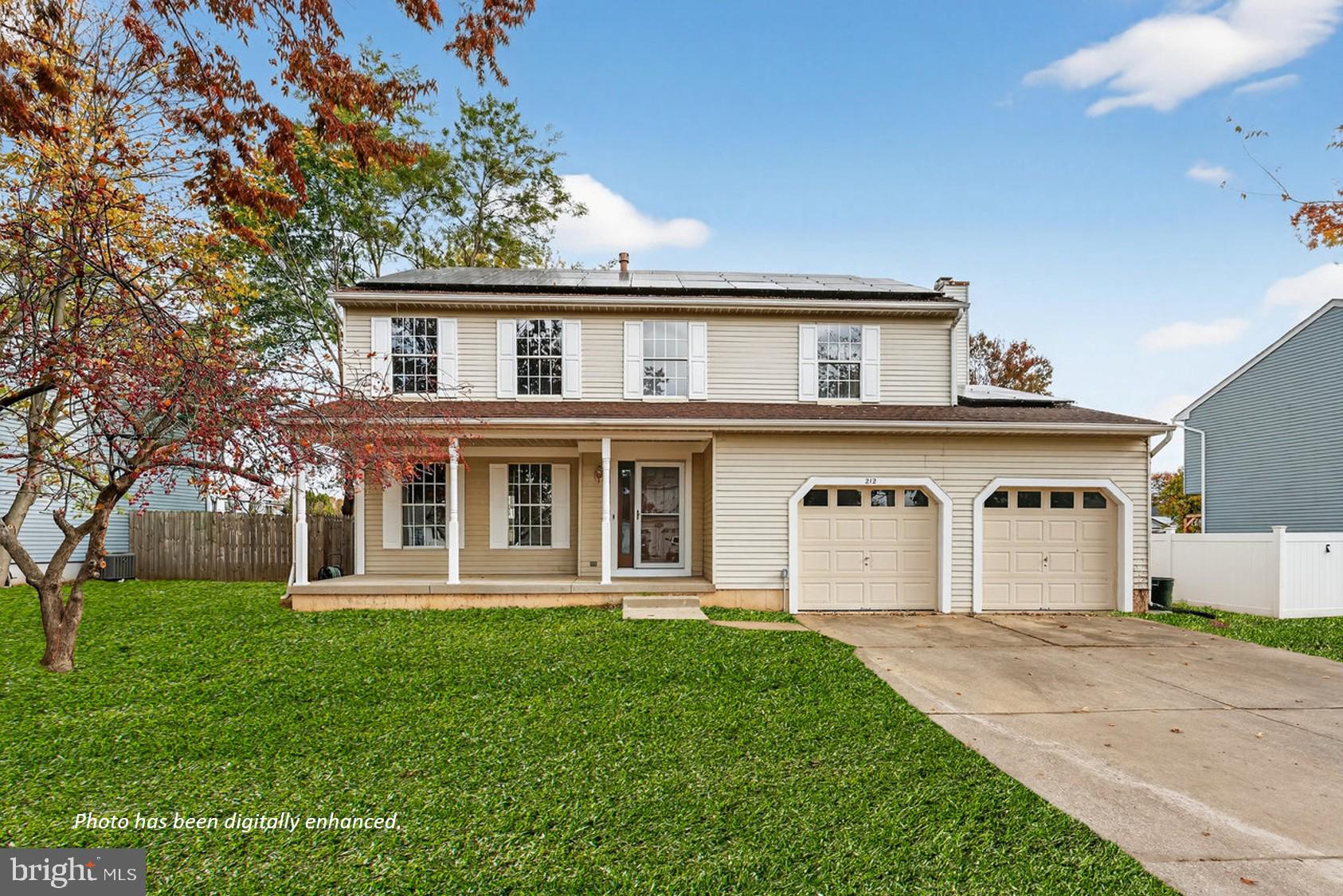 212 Chinnick Avenue Hamilton, NJ 08619 - Photo 1 of 17 a front view of a house with a yard and trees