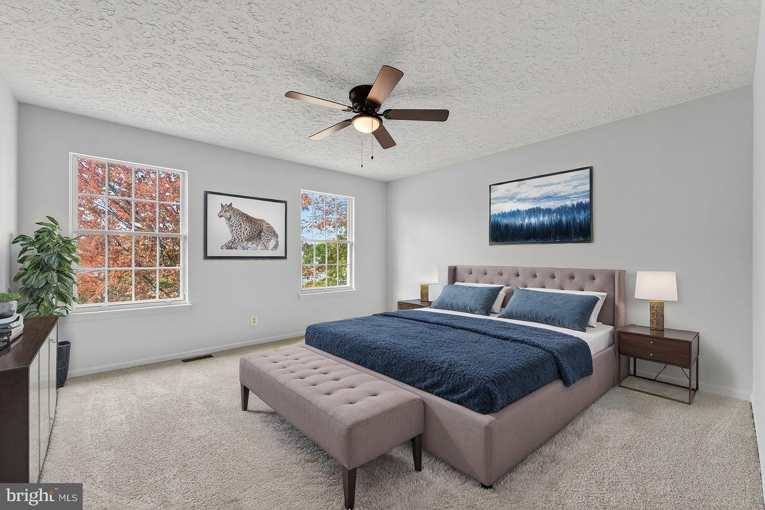 212 Chinnick Avenue Hamilton, NJ 08619 - Photo 11 of 17 a spacious bedroom with a bed a painting on the wall and a window