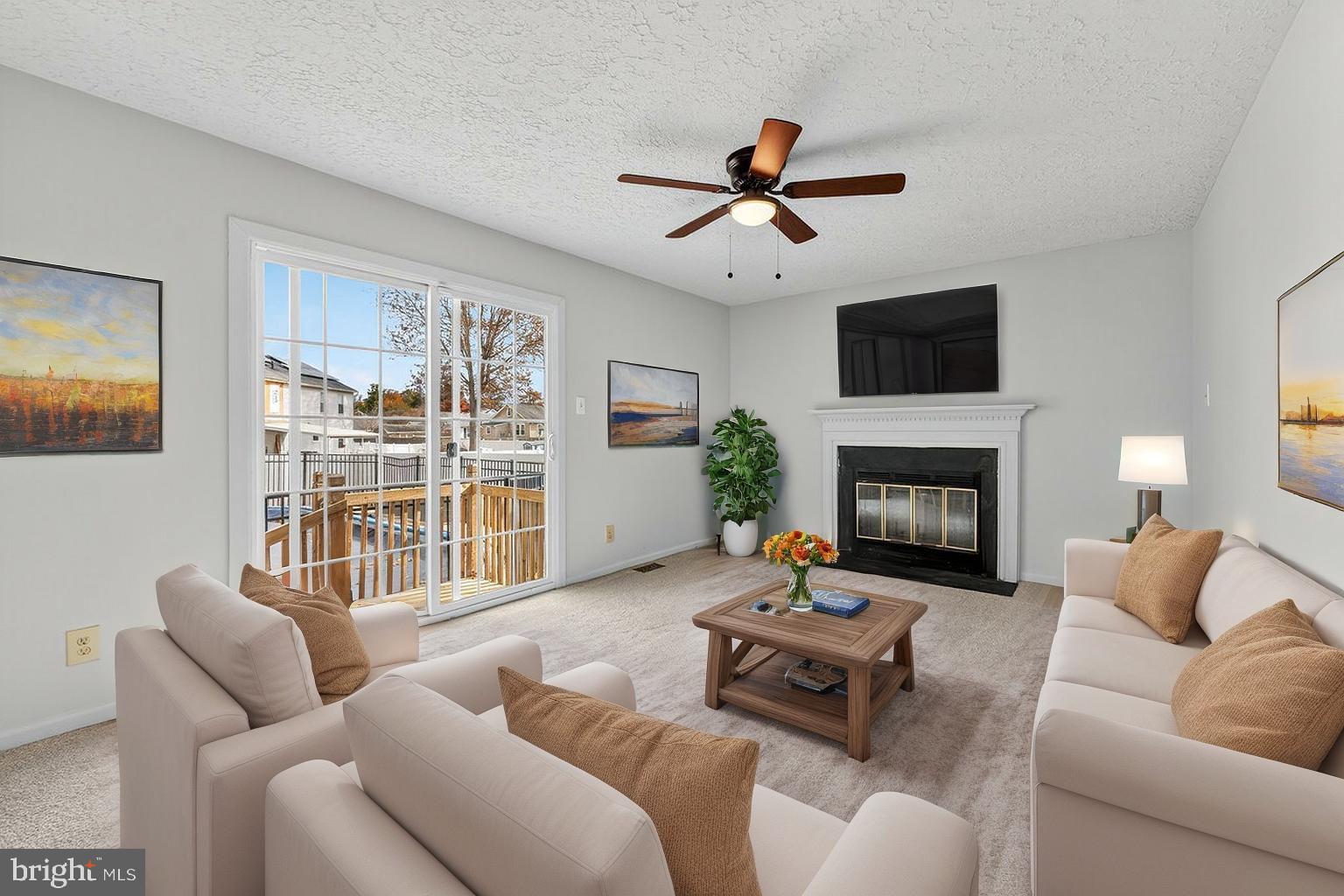 212 Chinnick Avenue Hamilton, NJ 08619 - Photo 5 of 17 a living room with furniture a flat screen tv and a fireplace