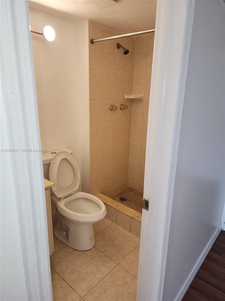 4222 Inverrary Boulevard, Unit 4215 Lauderhill, FL 33319 - Photo 11 of 20 a bathroom with a toilet and a shower