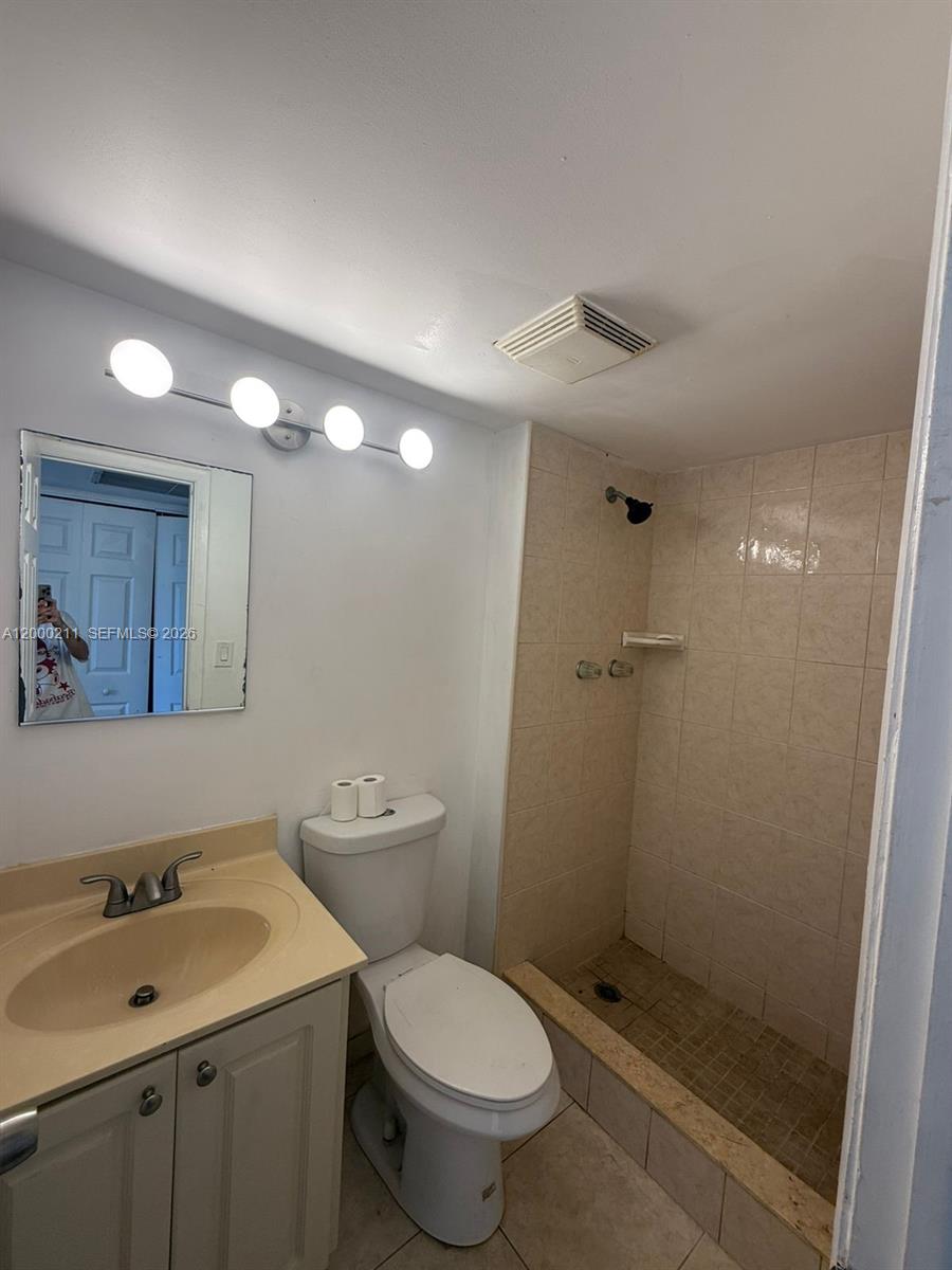 4222 Inverrary Boulevard, Unit 4215 Lauderhill, FL 33319 - Photo 16 of 20 a bathroom with a toilet sink and shower