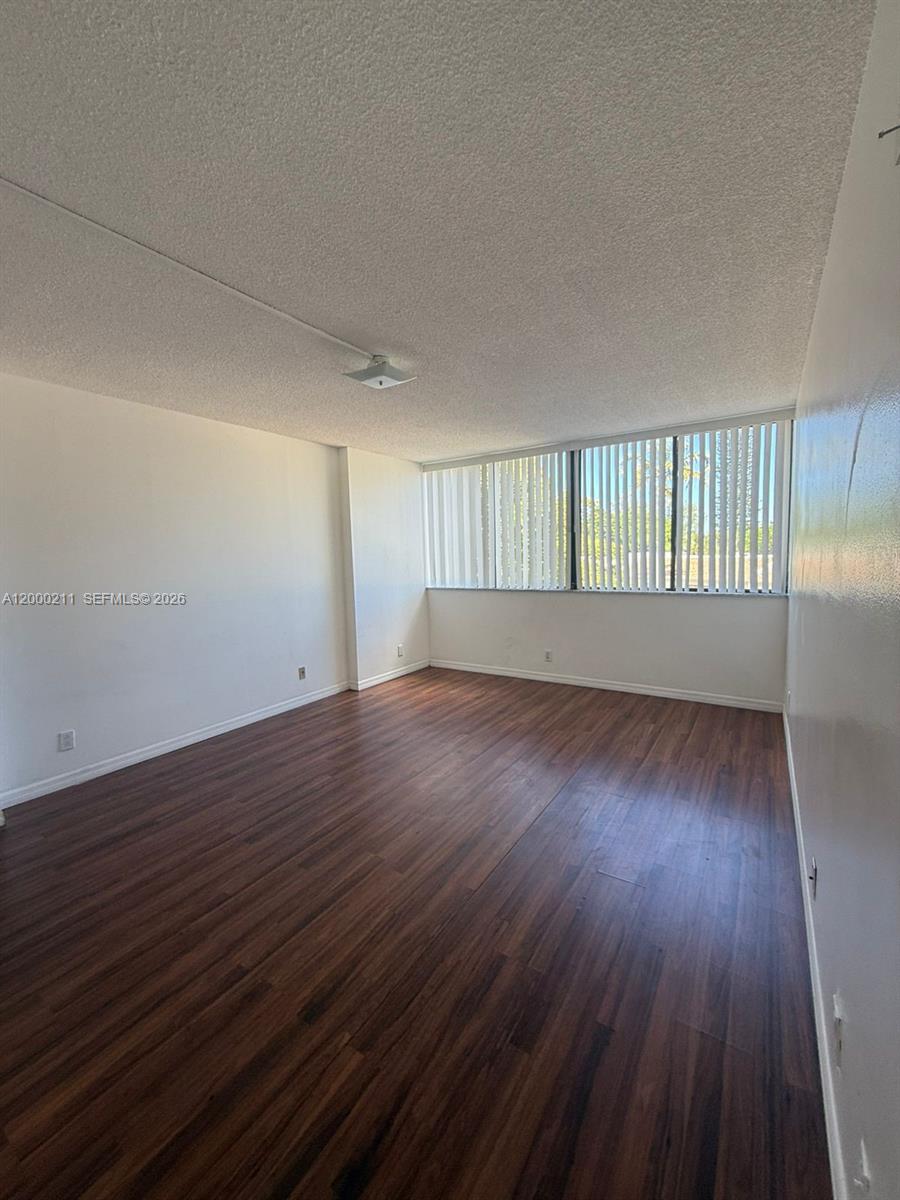 4222 Inverrary Boulevard, Unit 4215 Lauderhill, FL 33319 - Photo 19 of 20 an empty room with wooden floor